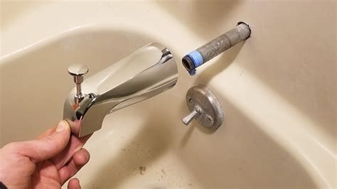 new tub spout leaking from back|How to Fix a Leaking Bathtub Faucet